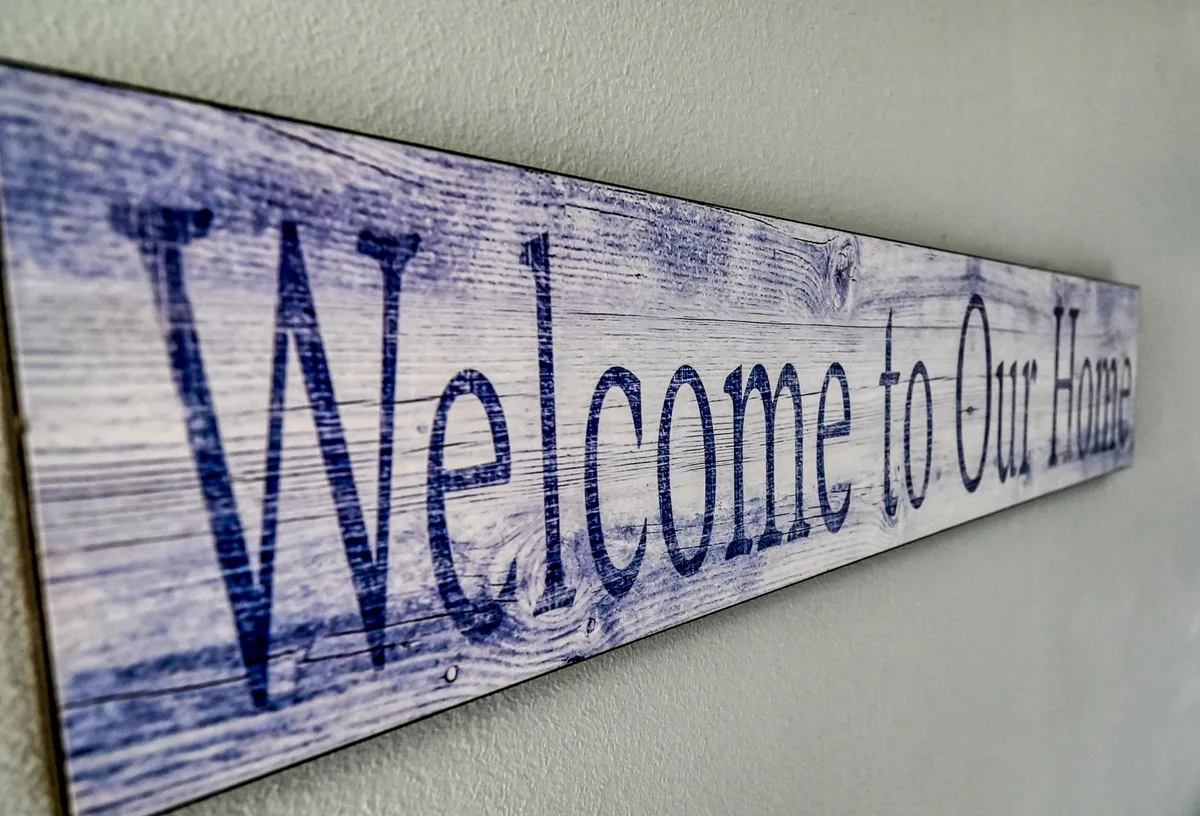 A welcoming 'Welcome' sign displayed inside the property, evoking a sense of hospitality and comfort as soon as guests arrive. The decor sets a friendly, inviting tone for shared spaces and common areas.
